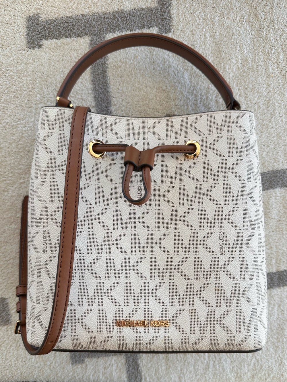 Cream Michael Kors bucket bag with brown trim